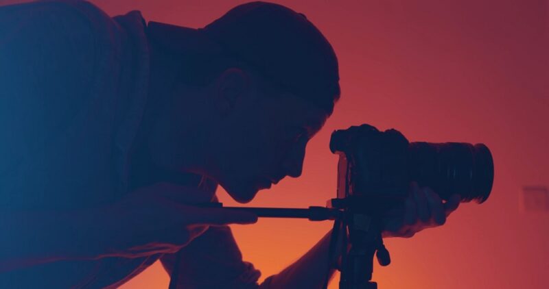 A guy taking a photo with his camera