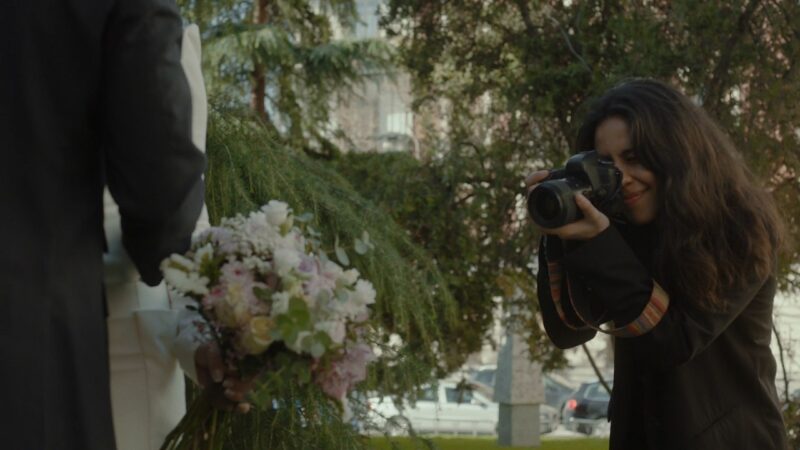 An experienced photographer captures a couple at their wedding